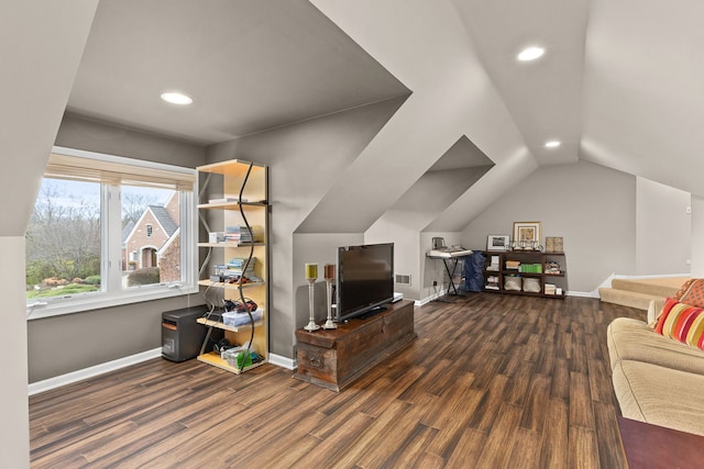 living room featuring vaulted ceiling and dark wood-type flooring