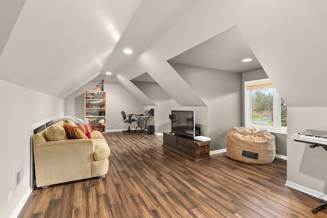 living room featuring lofted ceiling and wood-type flooring