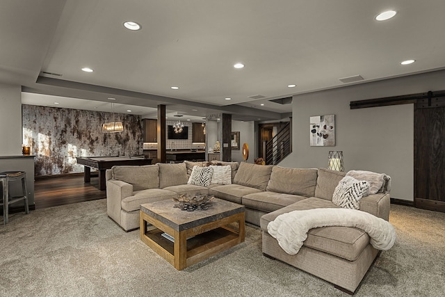 living room with billiards and a barn door