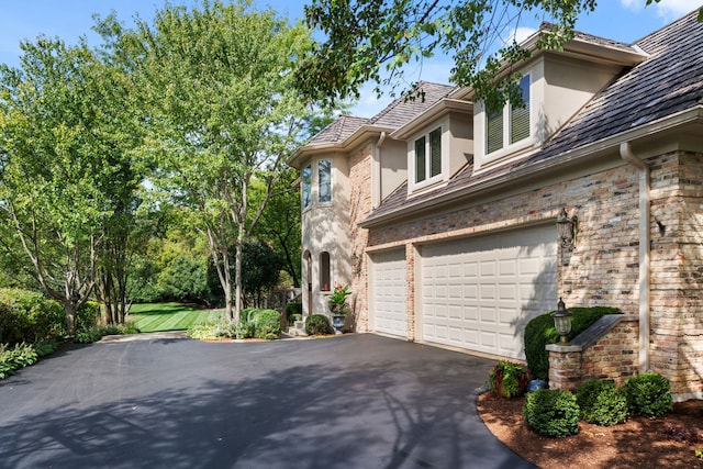 view of side of property featuring a garage