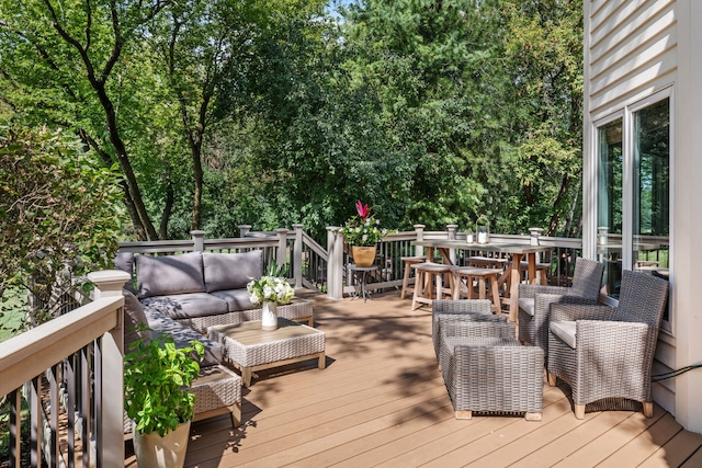 wooden deck featuring outdoor lounge area