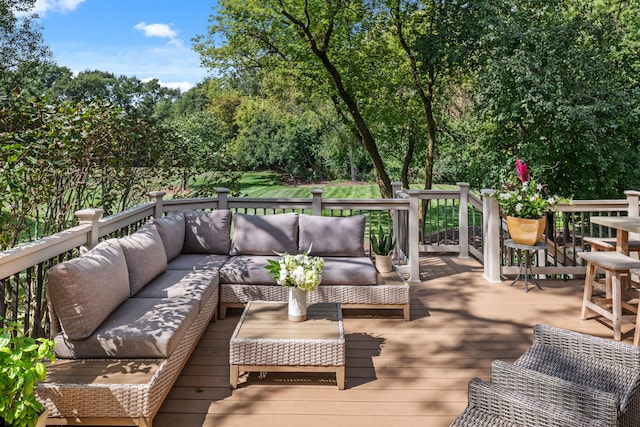 wooden deck with an outdoor living space