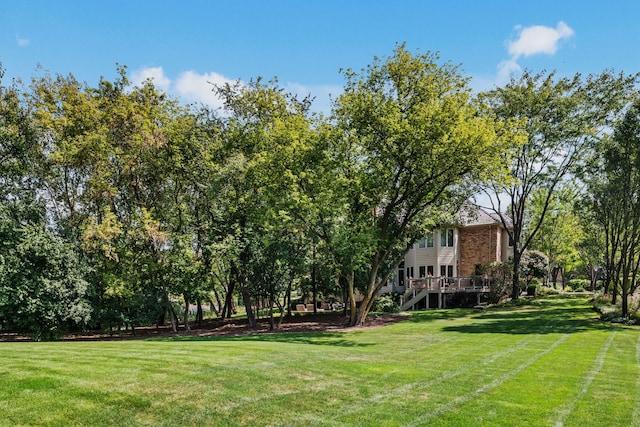 view of yard with a wooden deck