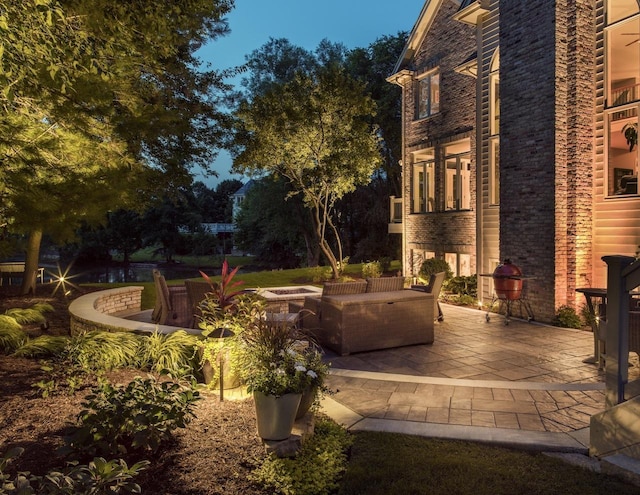 view of patio / terrace with an outdoor living space with a fire pit