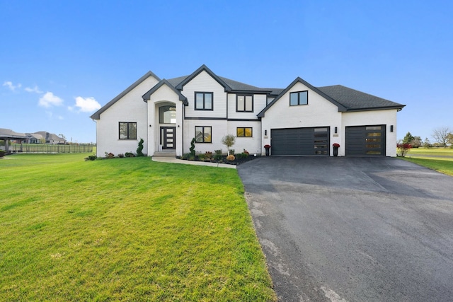 modern farmhouse with a garage and a front yard