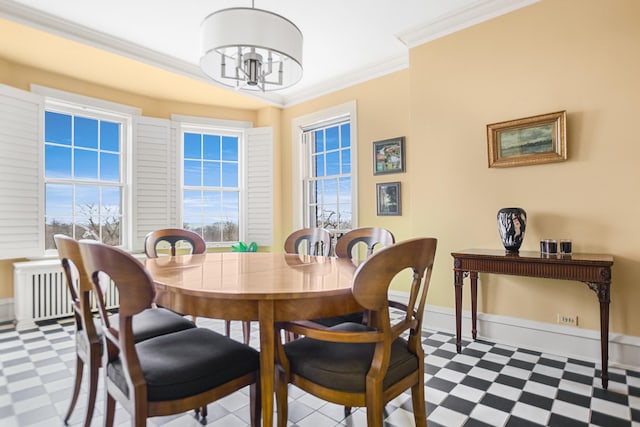 dining room featuring crown molding, plenty of natural light, and an inviting chandelier