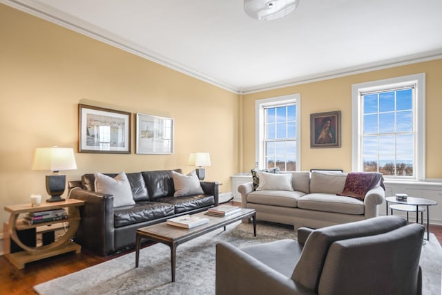 living room featuring ornamental molding, dark hardwood / wood-style flooring, and a wealth of natural light