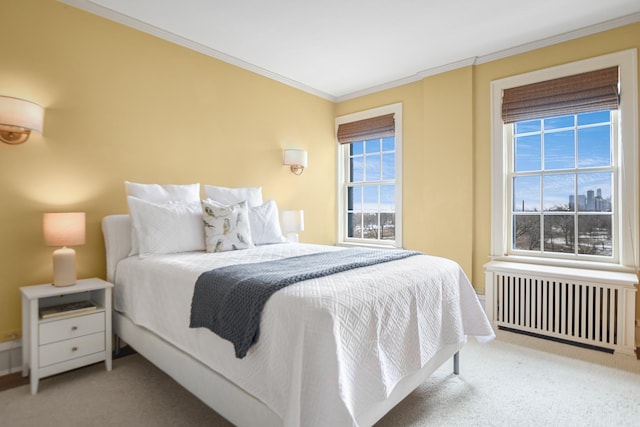 carpeted bedroom featuring radiator and crown molding