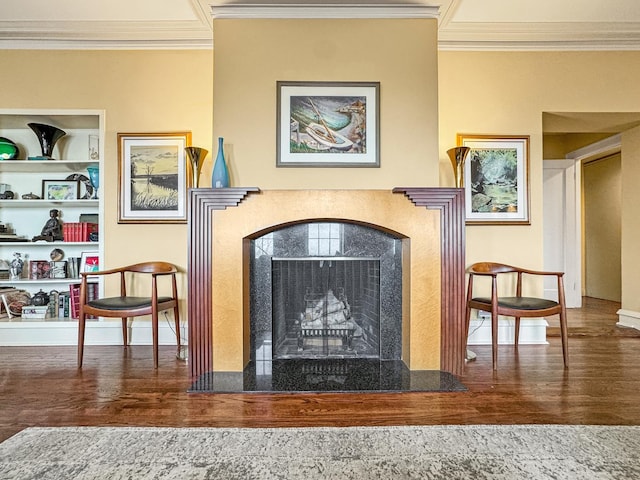 interior details with crown molding, a high end fireplace, and hardwood / wood-style floors