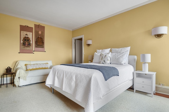 bedroom featuring crown molding and carpet