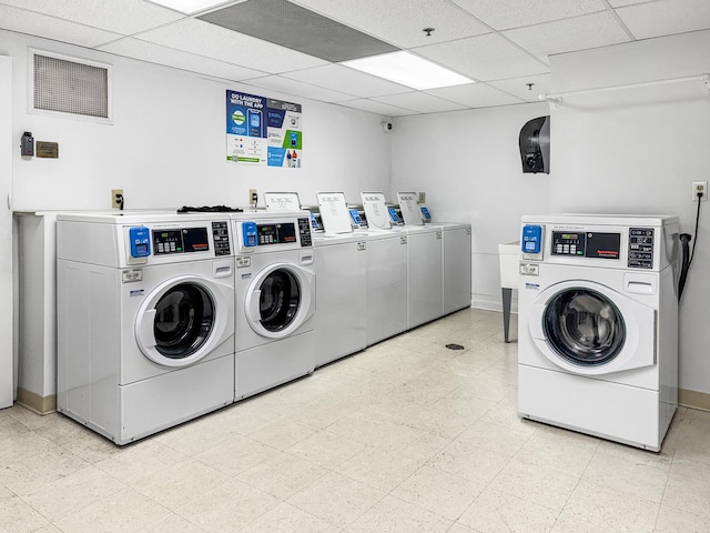 clothes washing area with separate washer and dryer