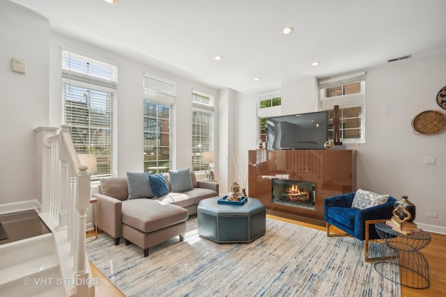 living room featuring plenty of natural light and wood-type flooring