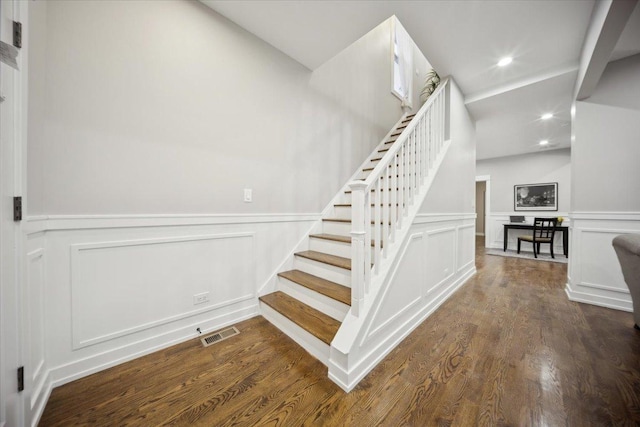 stairway featuring hardwood / wood-style flooring