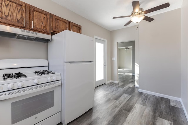 kitchen featuring wood-type flooring, ceiling fan, and white appliances