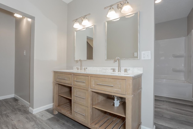 bathroom with hardwood / wood-style flooring and vanity