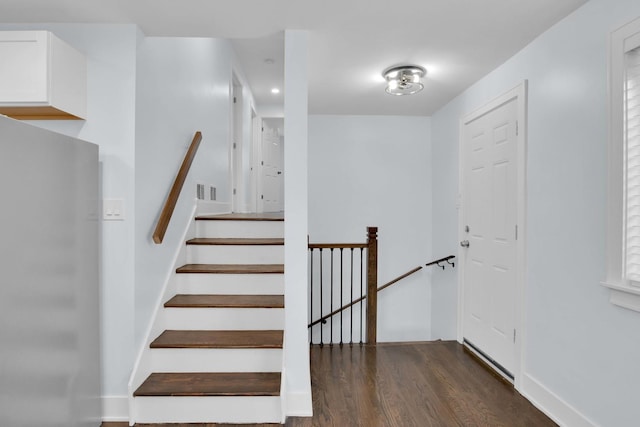 stairway featuring hardwood / wood-style flooring