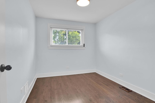 spare room featuring hardwood / wood-style flooring