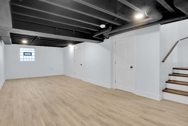 basement featuring light hardwood / wood-style flooring