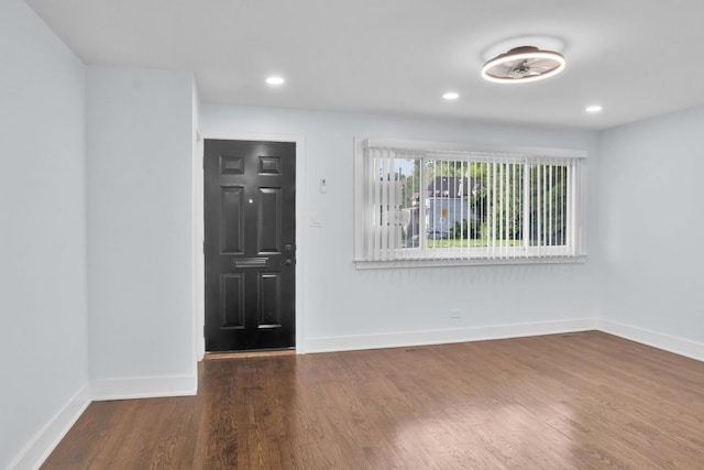 foyer with dark hardwood / wood-style flooring