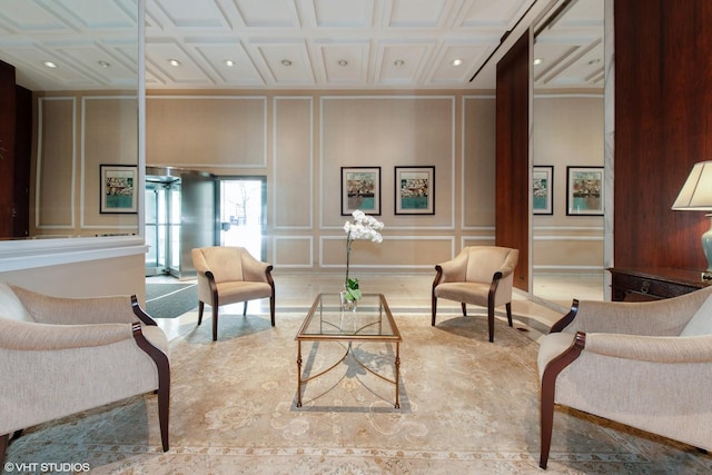 sitting room featuring coffered ceiling