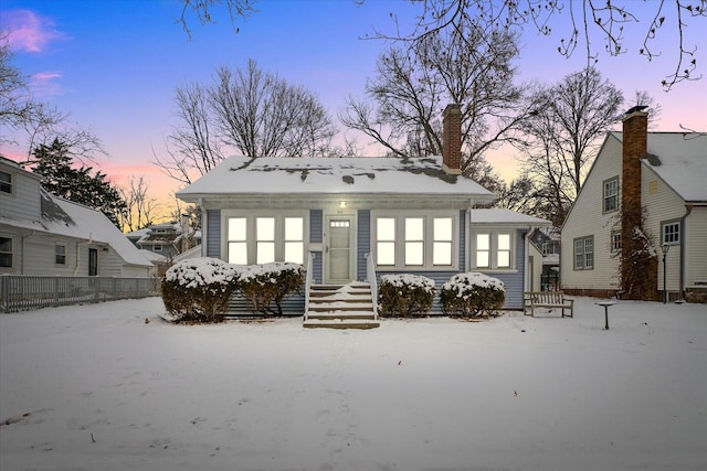 view of snow covered house