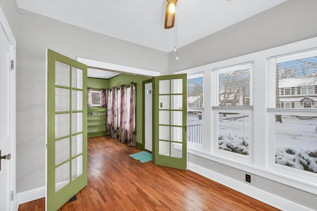 doorway to outside with french doors, hardwood / wood-style flooring, and ceiling fan