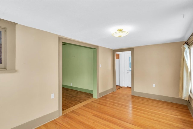 spare room with hardwood / wood-style floors