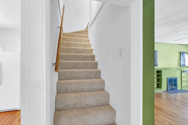 stairway with wood-type flooring