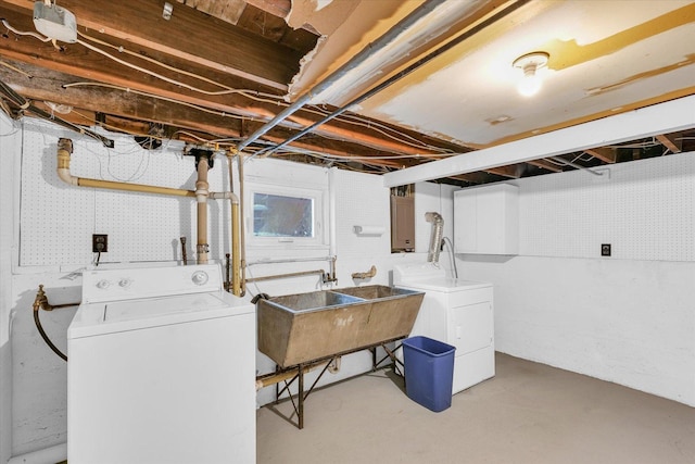 laundry area with sink and independent washer and dryer