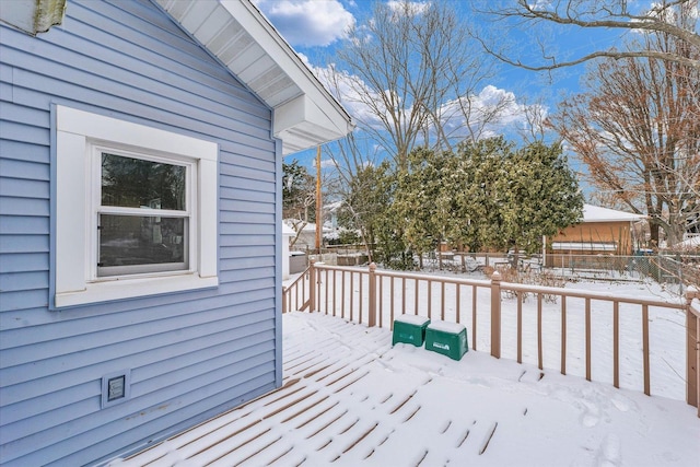 view of snow covered deck