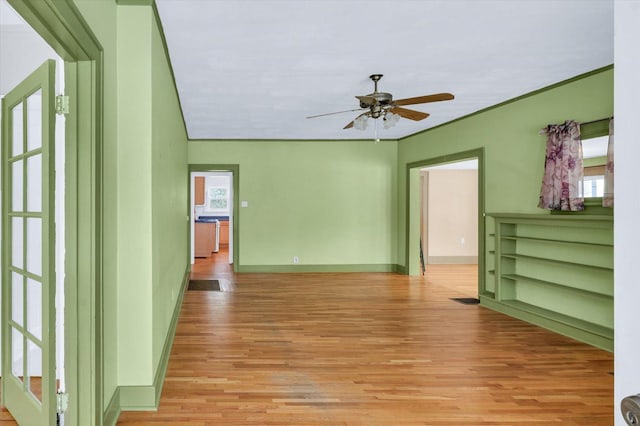 spare room featuring ceiling fan and light hardwood / wood-style floors