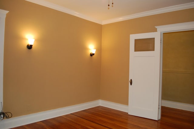 unfurnished room featuring dark hardwood / wood-style floors and crown molding