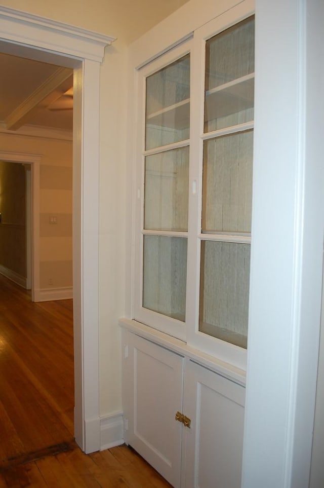 room details with hardwood / wood-style flooring and crown molding