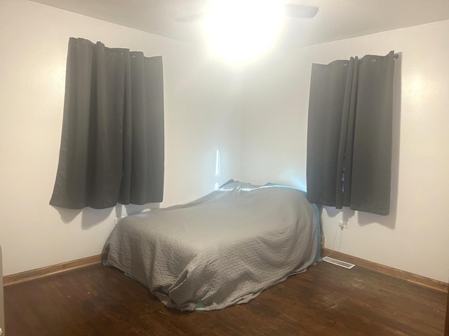 bedroom featuring dark hardwood / wood-style floors