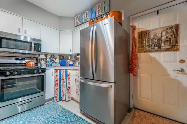 kitchen featuring white cabinetry and stainless steel appliances