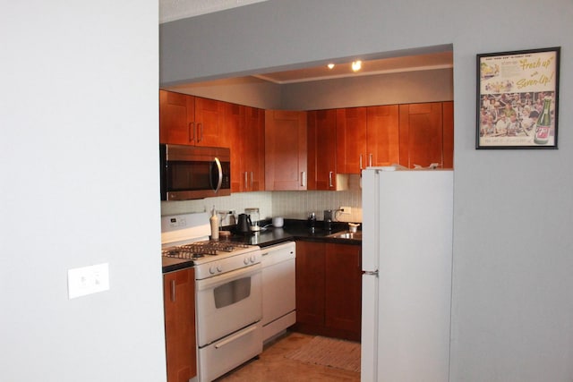 kitchen with backsplash and white appliances