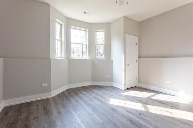 additional living space featuring light wood-type flooring