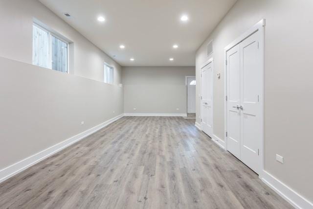 spare room featuring light hardwood / wood-style floors