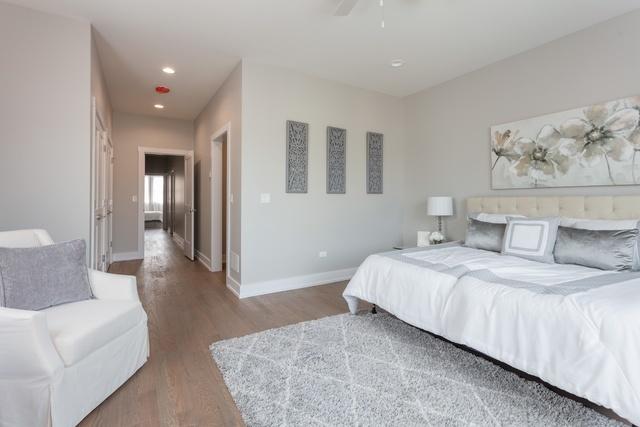 bedroom with ceiling fan and hardwood / wood-style floors