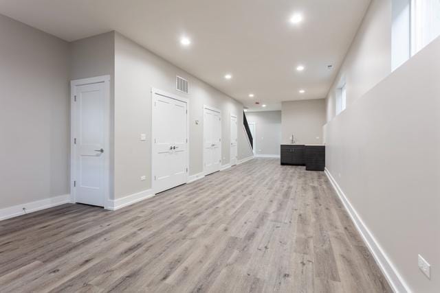 basement featuring light wood-type flooring