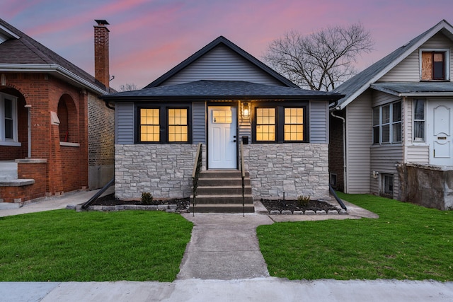 view of front of house with a yard