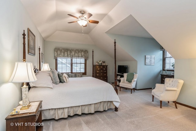 bedroom featuring ceiling fan, light colored carpet, and vaulted ceiling