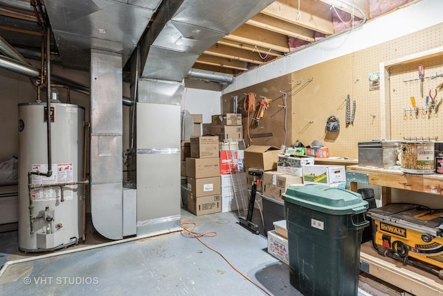 basement featuring a workshop area and gas water heater