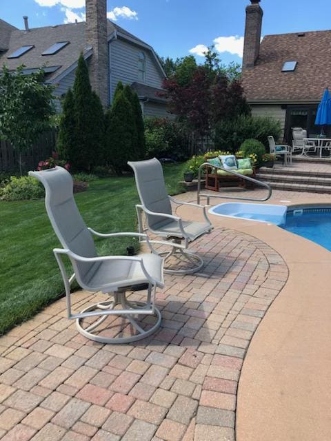 view of patio with a fenced in pool