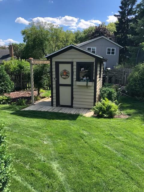 view of outbuilding with a lawn