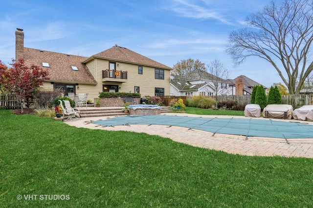 view of pool featuring a patio area and a lawn