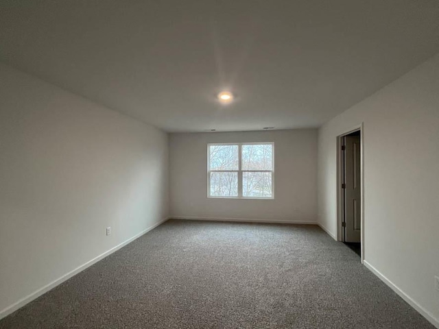 empty room featuring carpet flooring