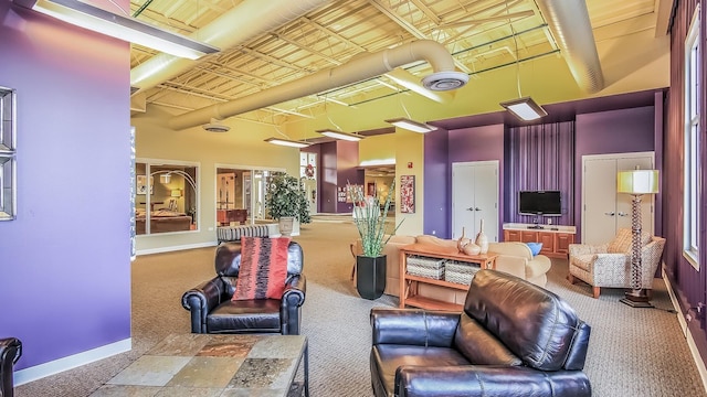 dining space featuring a drop ceiling, a healthy amount of sunlight, and sink