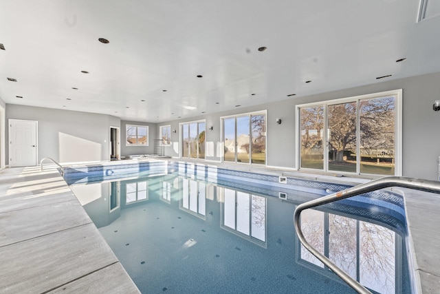 view of swimming pool featuring a jacuzzi