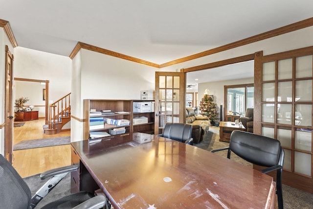 office area featuring french doors, light hardwood / wood-style flooring, and ornamental molding